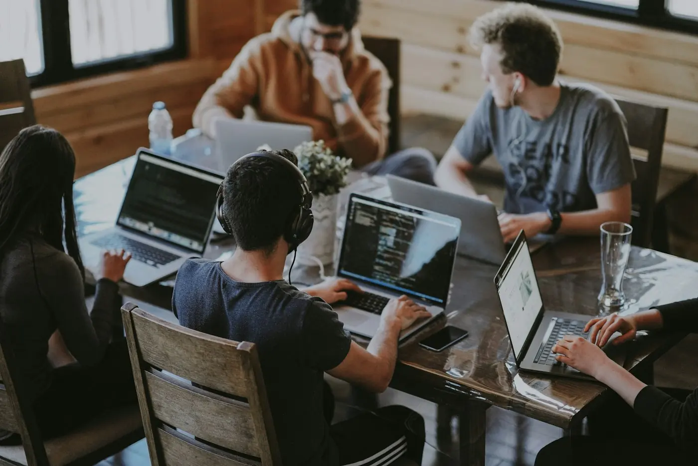 Engineers working together on laptops